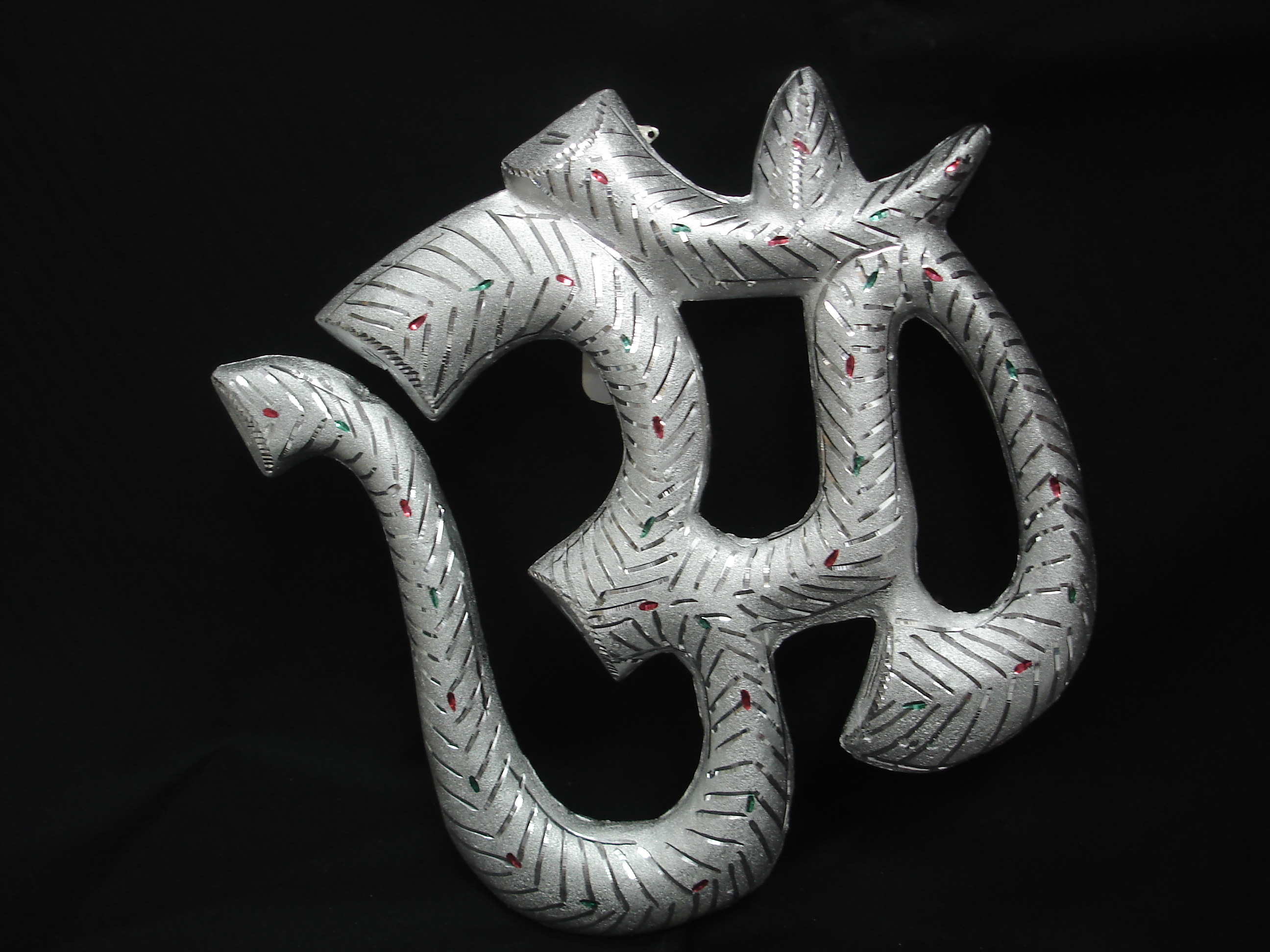Manufacturers Exporters and Wholesale Suppliers of White Metal Om Karol Bagh 